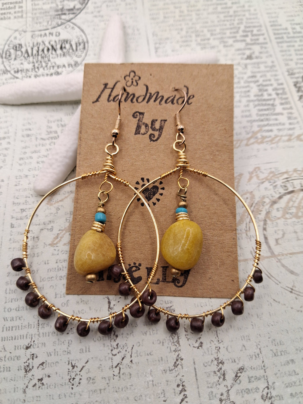Amber and brown wire wrapped hoop earrings with natural stone beads, handmade by Melly