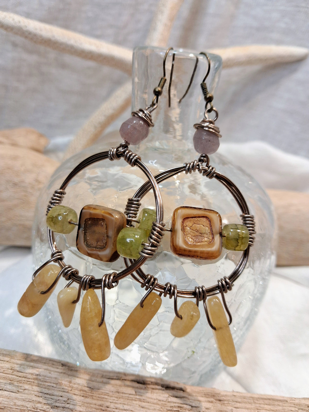 Amber and lavender dream catcher hoop earring with wire-wrapped beads, handmade by Melly