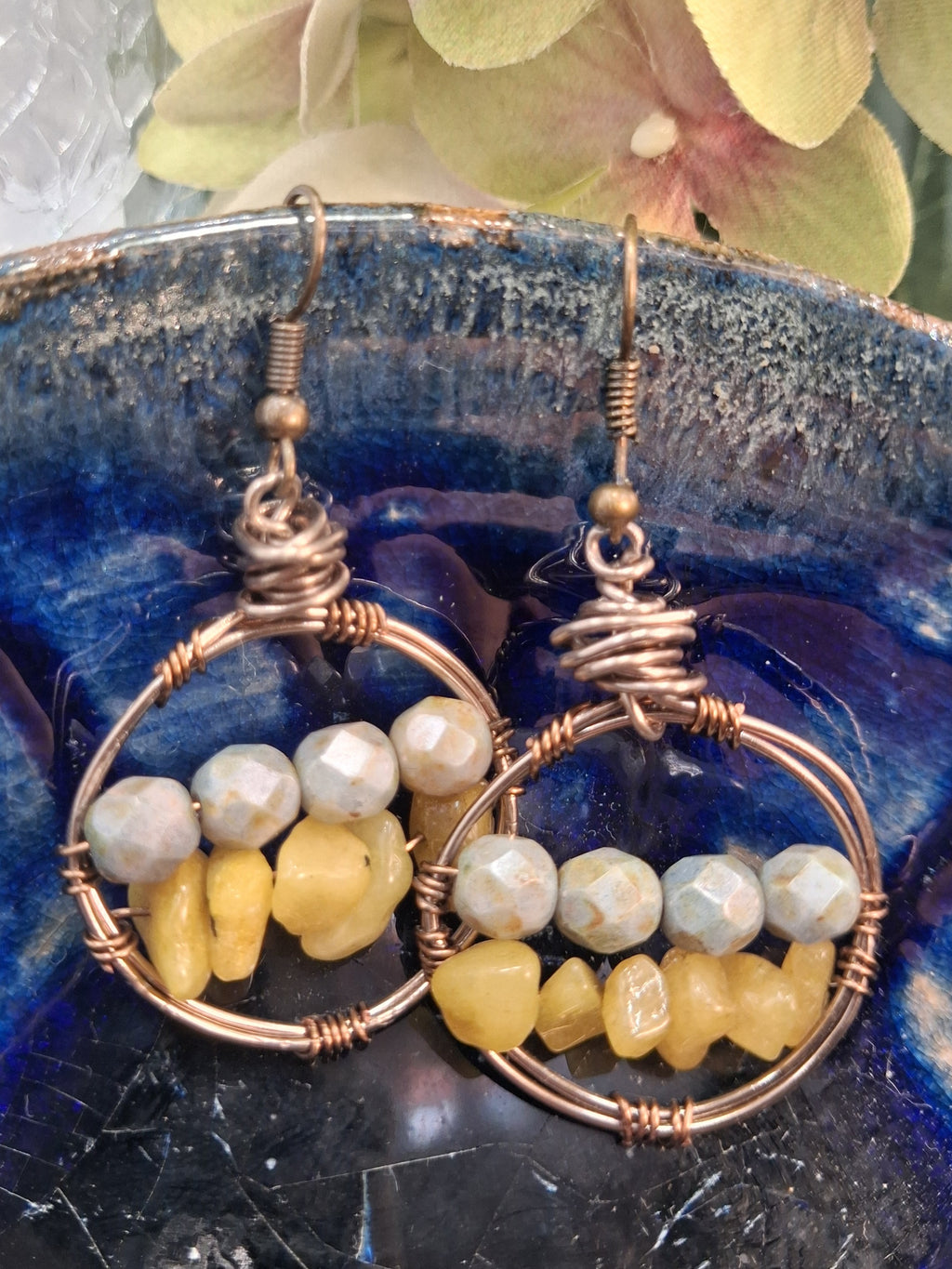 Amber and light grey beaded wire wrapped hoop earrings with bronze hooks, handmade by Melly