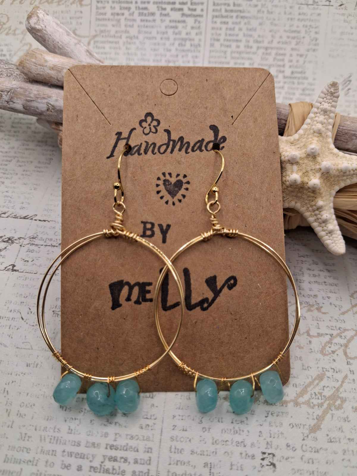 Aqua blue and gold wire wrapped large hoop earrings with dangling beads, handmade by Melly