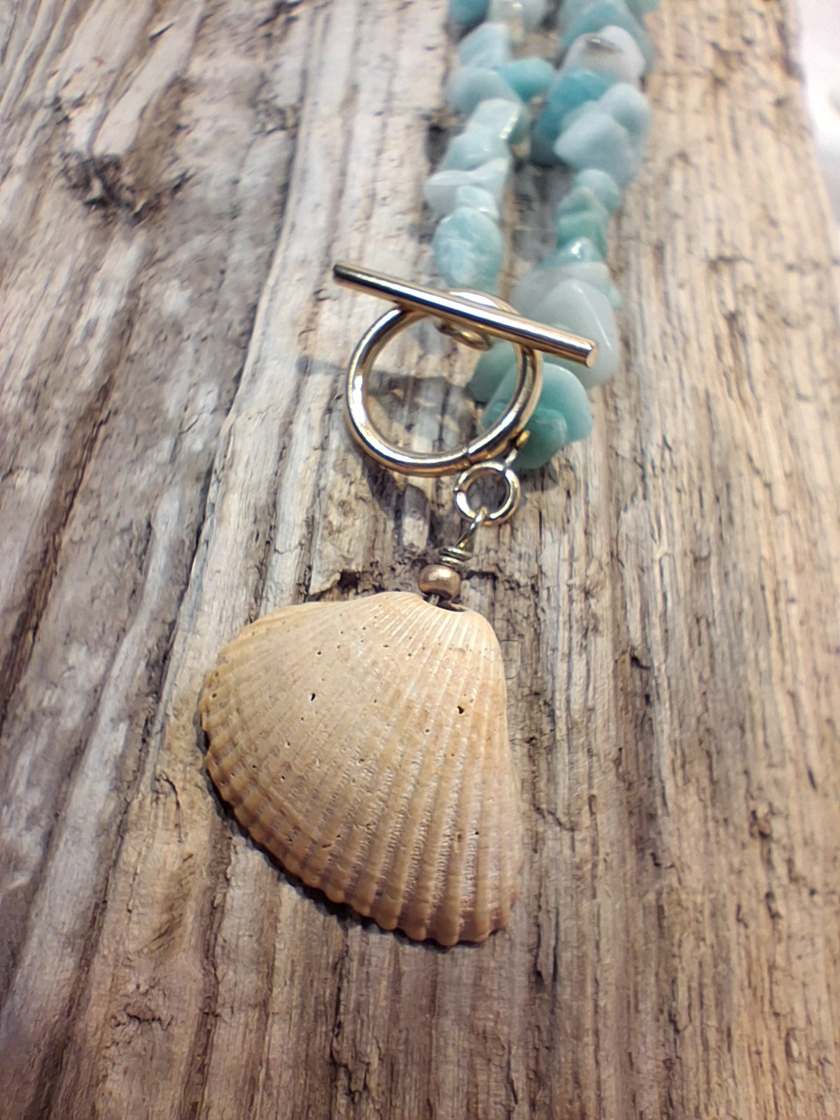 Light blue amazonite gemstone chip beads and a natural seashell pendant with a toggle clasp, handmade by Melly