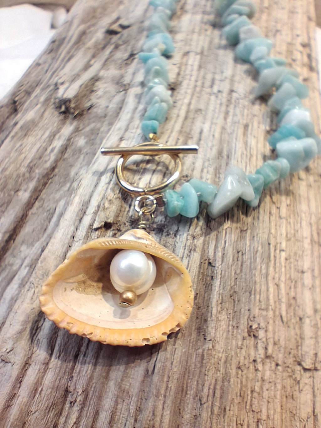 Blue chip necklace with a seashell pendant and white pearl, handmade by Melly