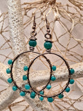 Aquamarine blue beaded hoop earrings with copper wire wrapping, handmade by Melly