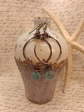 Aquamarine glass bead and wire wrapped copper hoop earrings, handmade by Melly
