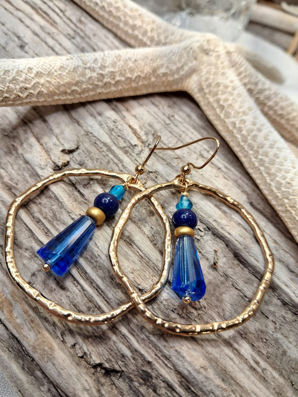 Cobalt and gold beaded hoop earrings featuring gold wire and glass beads, handmade by Melly