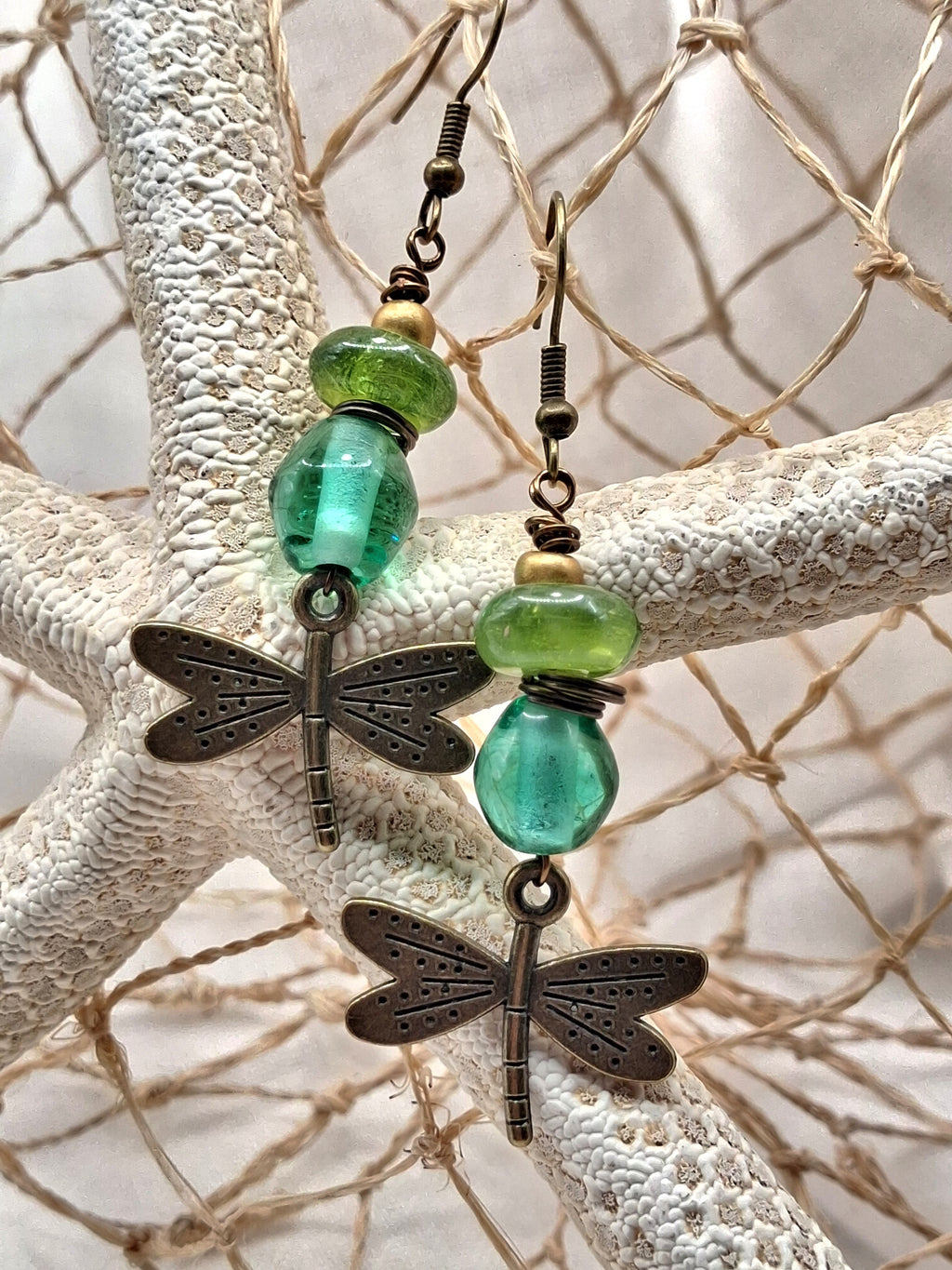 Emerald green and aquamarine glass bead dragonfly dangle earrings with bronze charms, handmade by Melly
