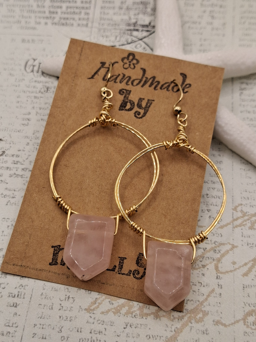 Gold and rose quartz wire wrapped hoop earrings with hanging gemstone points, handmade by Melly
