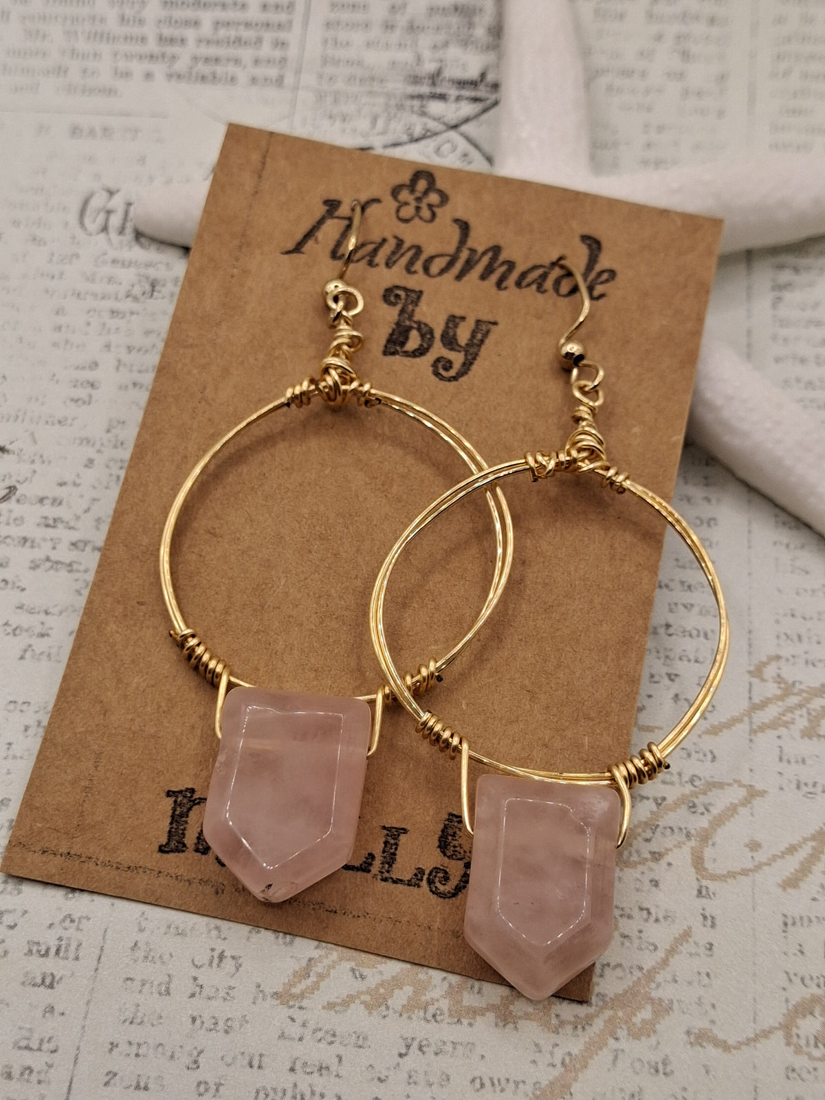 Gold and rose quartz wire wrapped hoop earrings with hanging gemstone points, handmade by Melly