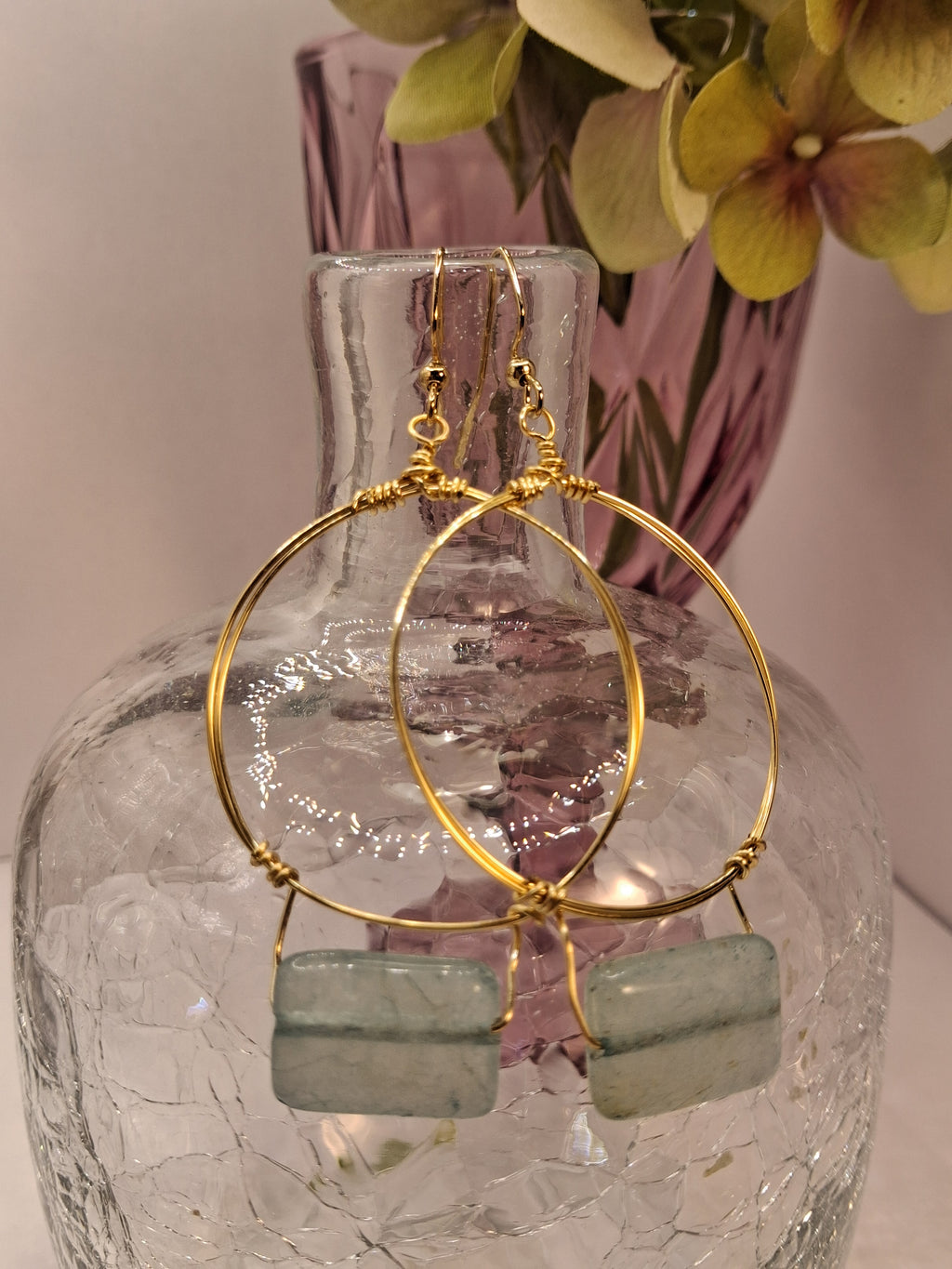 Ice blue rectangular stone and gold wire wrapped small hoop earrings, handmade by Melly