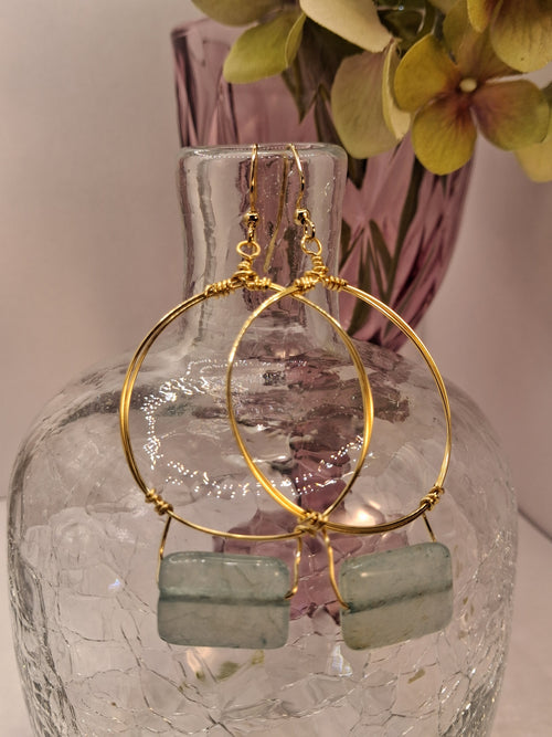 Ice blue rectangular stone and gold wire wrapped small hoop earrings, handmade by Melly