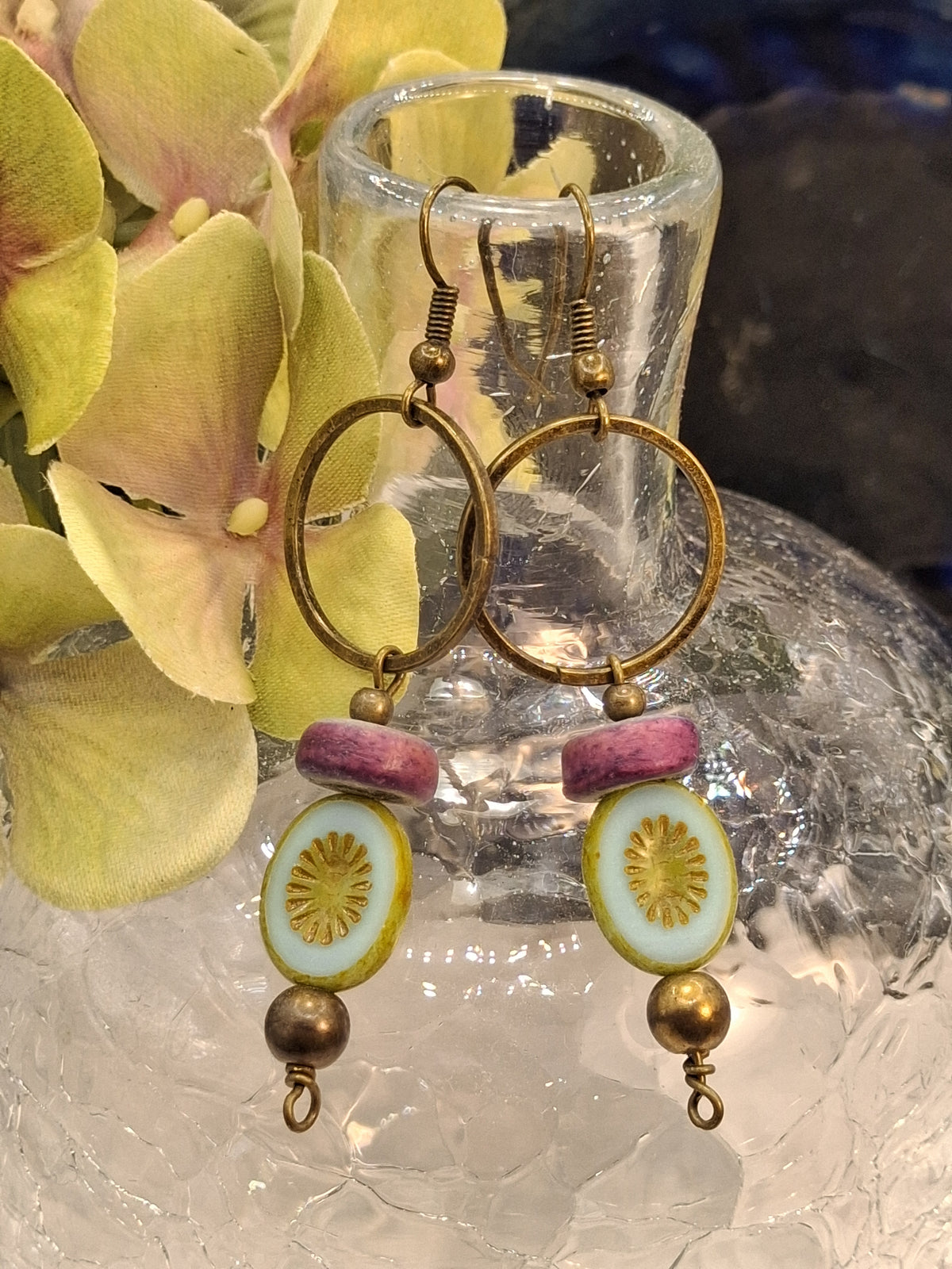 Lavender and mint dangle earrings with brass hoops and patterned beads, handmade by Melly