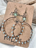 Light blue and copper wire-wrapped hoop earrings handmade by Melly