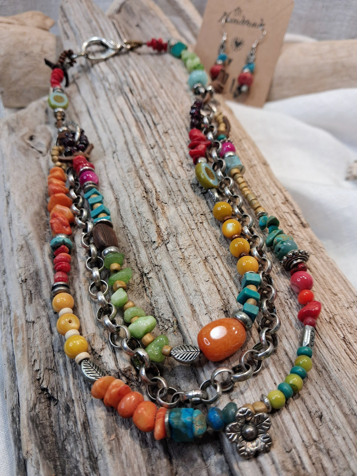 Orange, red and lime beaded cocktail necklace featuring multi-strand chains, handmade by Melly