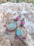 Red ruby, strawberry quartz, and copper wire-wrapped hoop earrings handmade by Melly