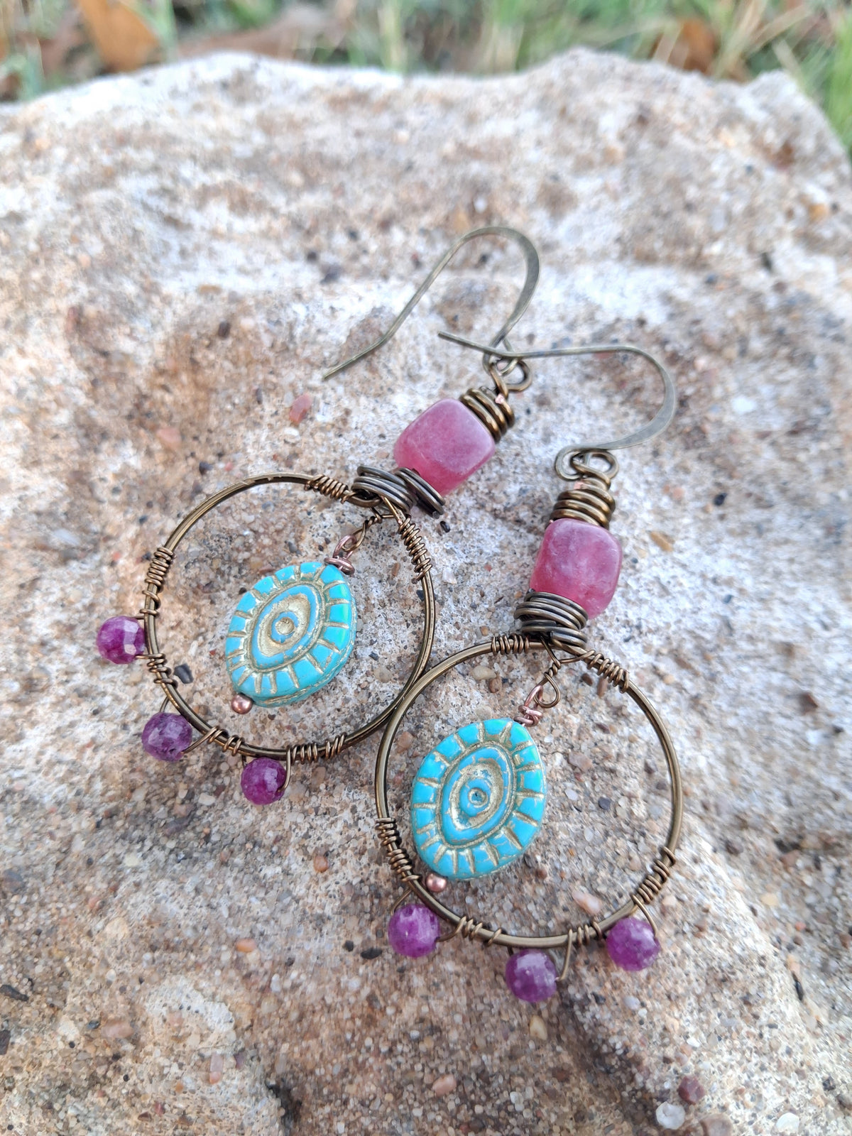Red ruby, strawberry quartz, and copper wire-wrapped hoop earrings handmade by Melly