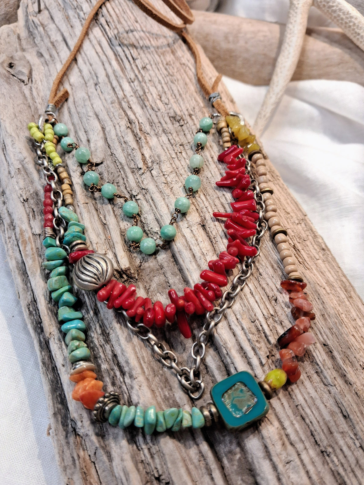 Teal, red and rose beaded horizon necklace with layered metal chains and stones, handmade by Melly
