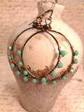 Turquoise and copper wire wrapped hoop earrings with faceted beads, handmade by Melly