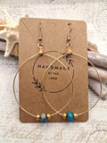 Turquoise and gold beaded classic hoop earrings with wire-wrapped metal wires, handmade by Melly