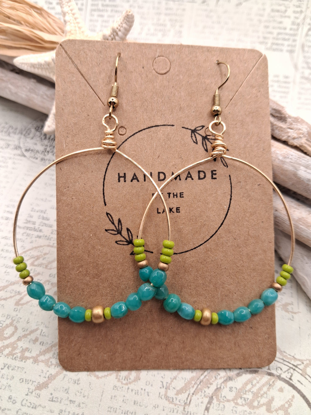 Turquoise and lime beaded beach hoop earrings with glass beads and wire, handmade by Melly.