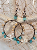 Turquoise and maple wire wrapped starfish hoop earrings with beaded accents, handmade by Melly