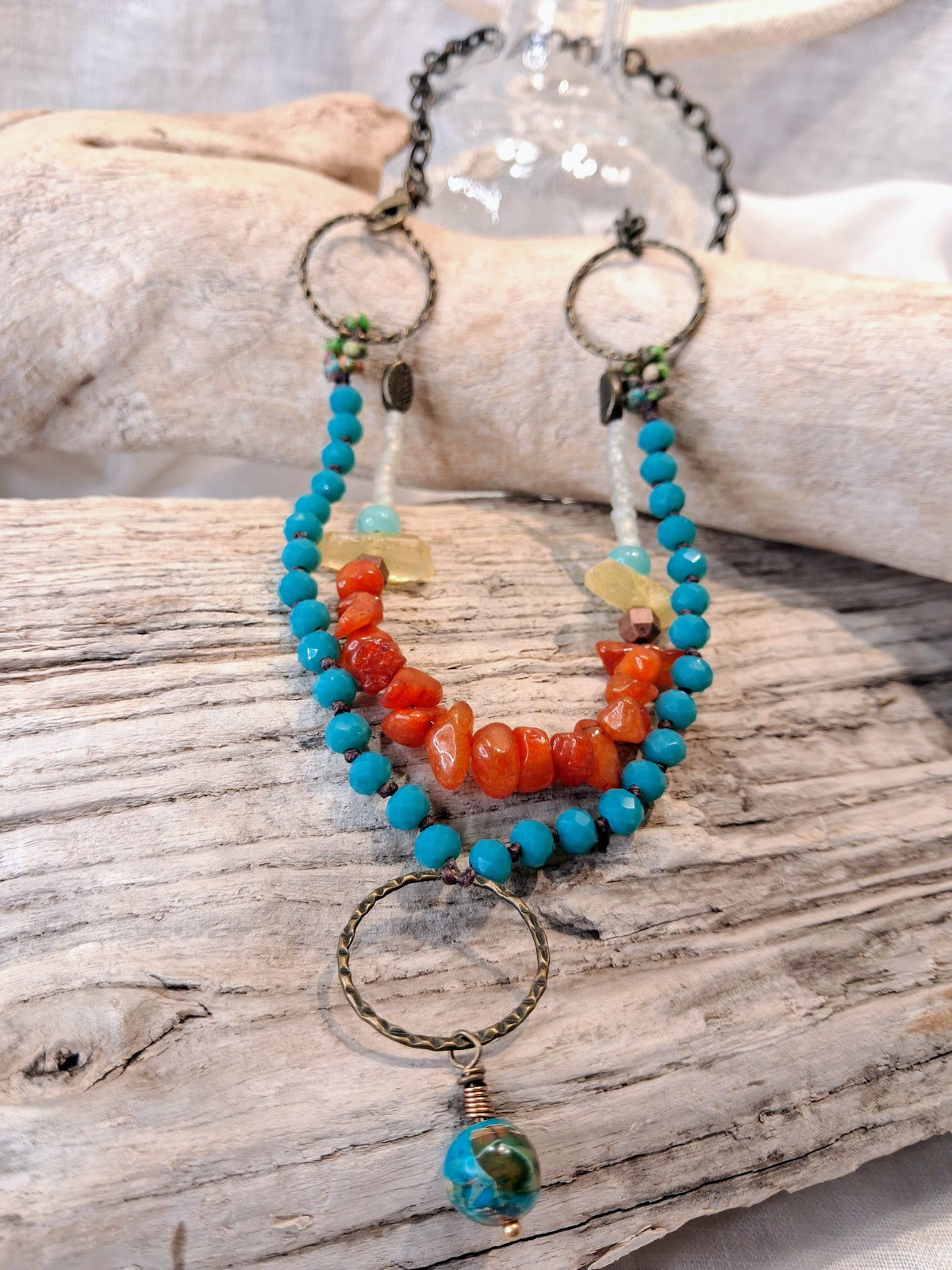 Turquoise and red orange beaded rustic necklace with multi-strand stone chips and metal rings, handmade by Melly