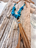 Blue turquoise stone chips and brown suede leather tassel necklace with a metal ring, handmade by Melly