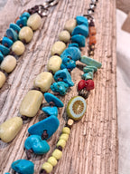 Turquoise and yellow wood beaded necklace on brown cord with silver chain, handmade by Melly