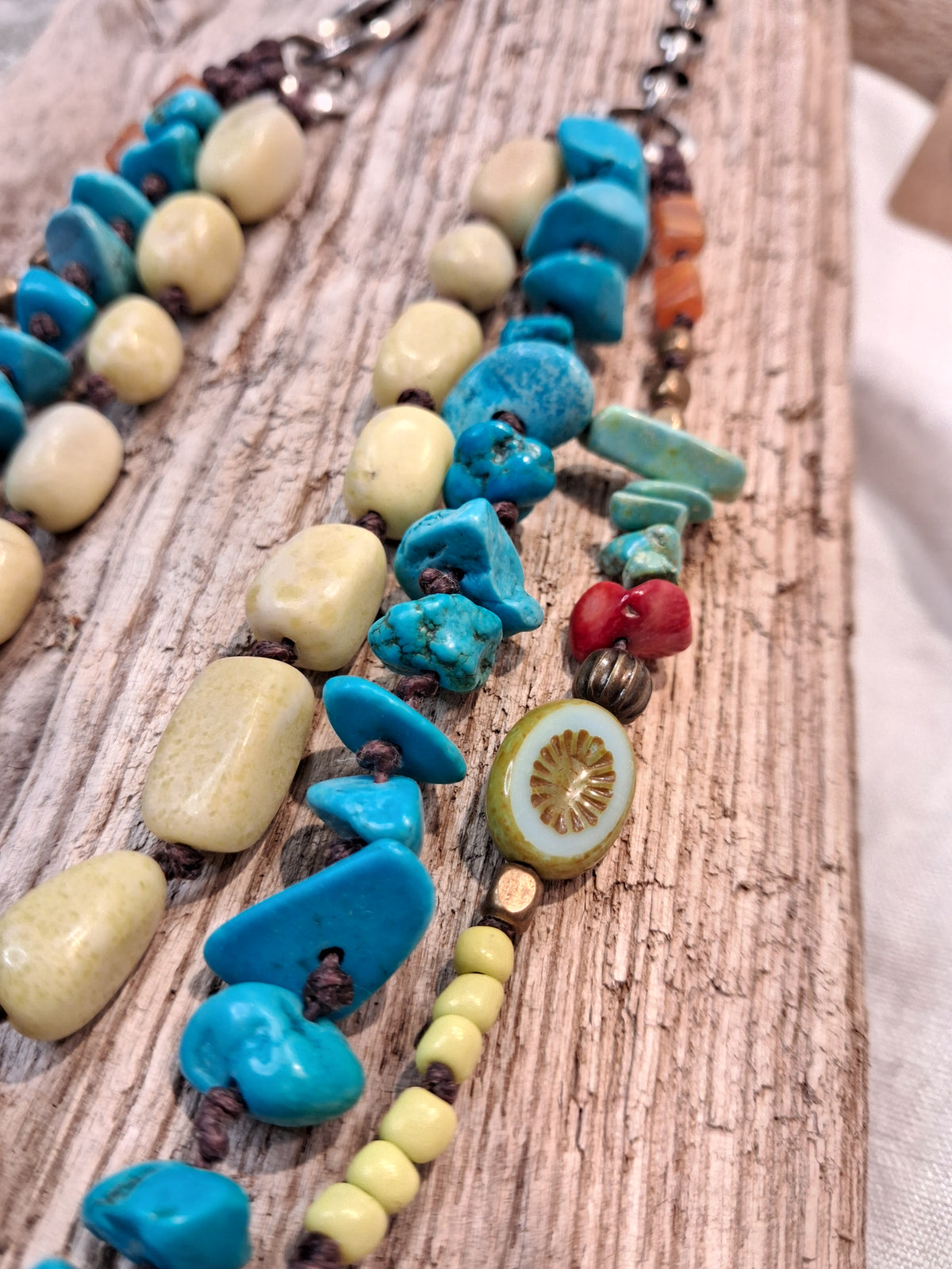 Turquoise and yellow wood beaded necklace on brown cord with silver chain, handmade by Melly