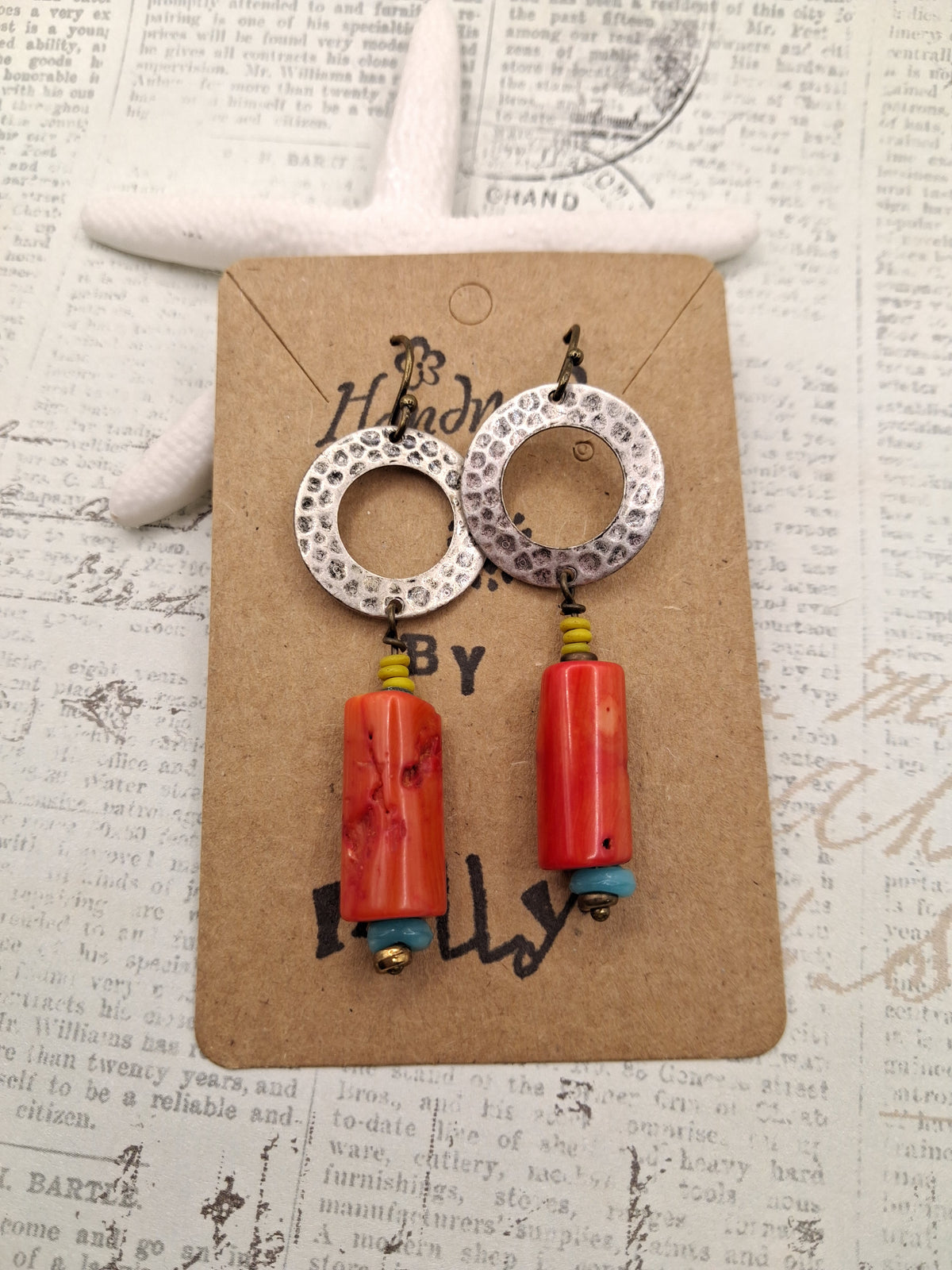 Vermillion red coral dangle earrings featuring hammered silver circles, handmade by Melly