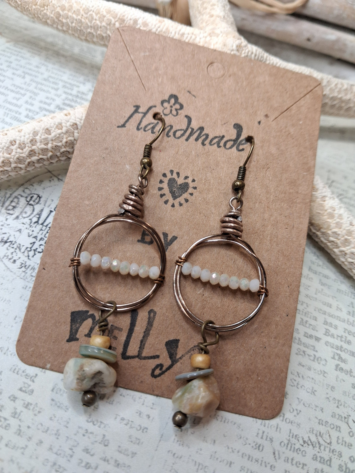 White faceted glass beads and silver metal hoops on dangle earrings, handmade by Melly