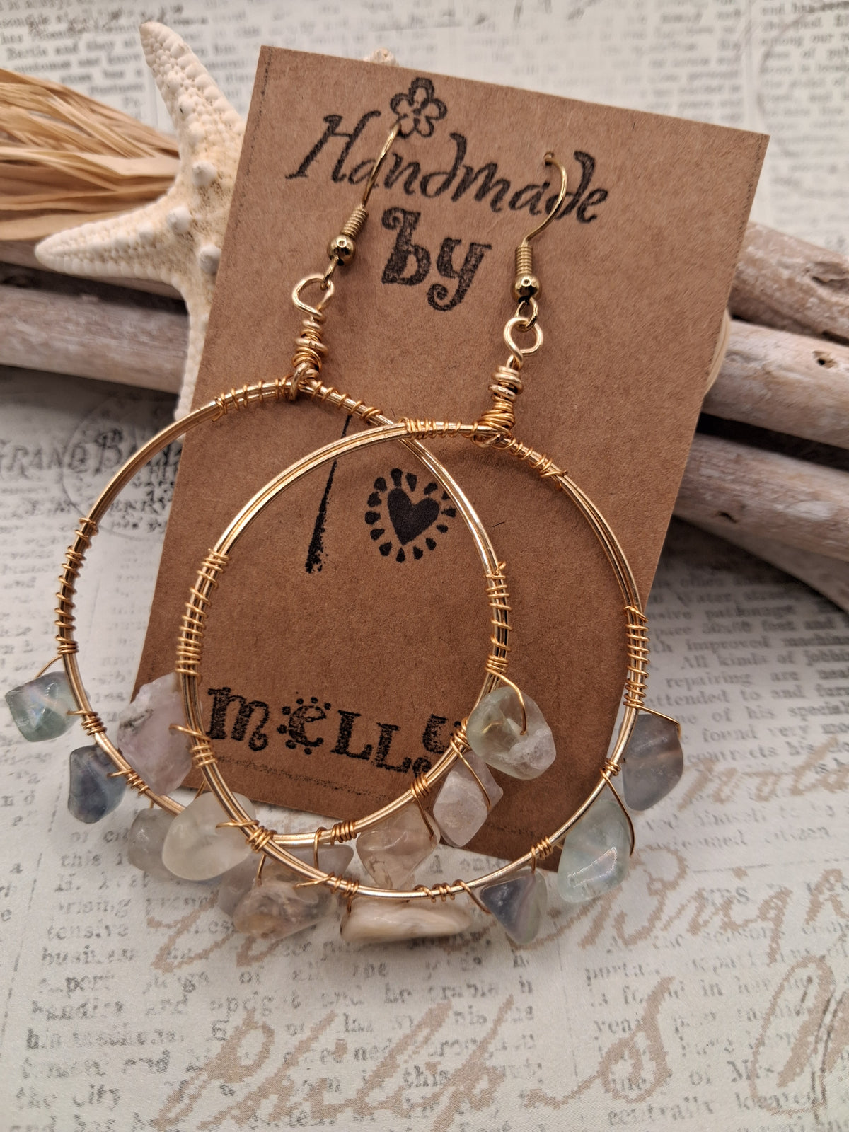 White and pink fluorite chips wire wrapped onto gold hoop earrings, handmade by Melly